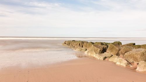 Scenic view of beach against sky