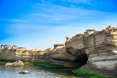 Scenic view of landscape against blue sky