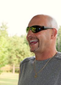 Close-up of smiling man wearing sunglasses