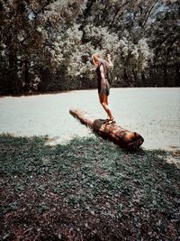 Full length of man jumping in lake
