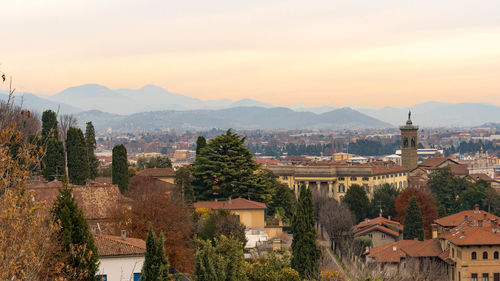 View of town against sky during sunset