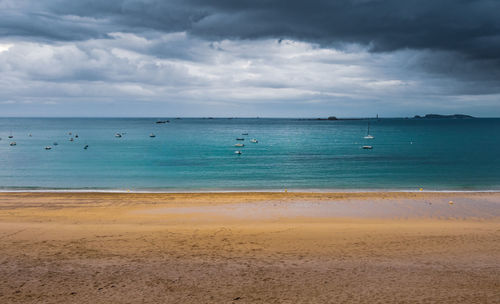 Scenic view of beach against sky