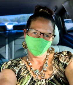 Portrait of young woman in car