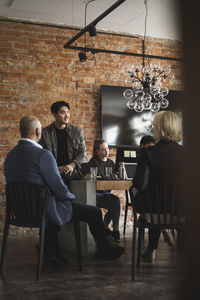 Group of people working on table