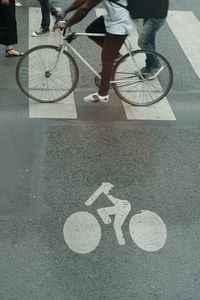 Low section of people crossing road on zebra crossing