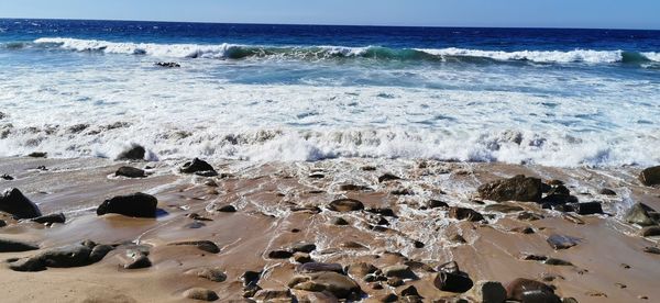 Scenic view of beach against sky