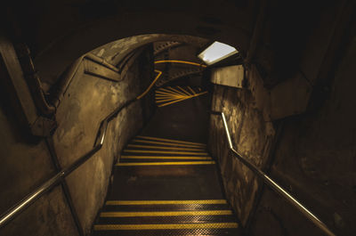 High angle view of steps in illuminated tunnel