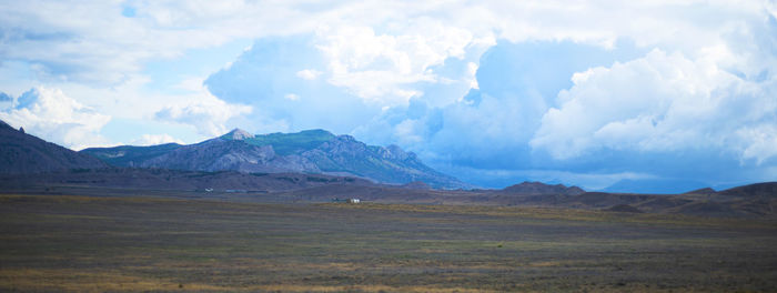 Landscape panorama. mountains plain sky with clouds. picturesque area. copy copy for text.