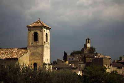 Stormy weather and dramatic sky over the old village of lourmarin, in provence, france