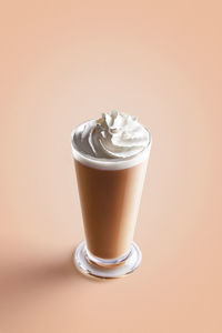 Close-up of coffee cup against white background