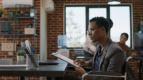 Side view of businessman working at office