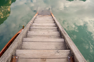 Wooden jetty leading to pier over lake