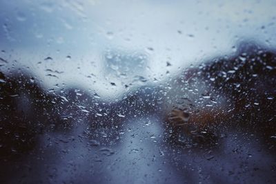 Full frame shot of raindrops on glass window