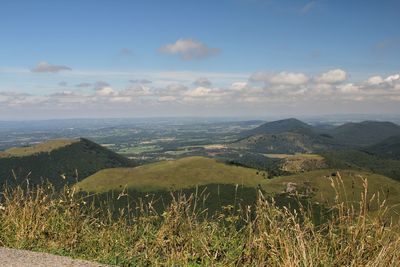 Scenic view of landscape against cloudy sky