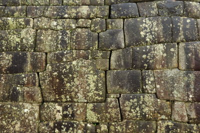 Full frame shot of weathered stone wall