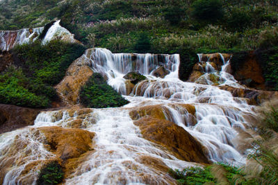 View of waterfall in forest