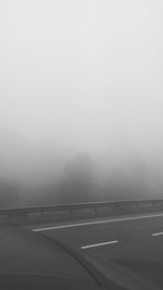 Road against sky during foggy weather