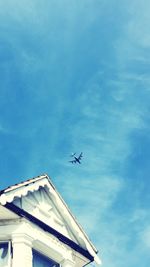 Low angle view of airplane flying in sky