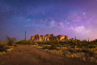 Scenic view of desert against sky at night