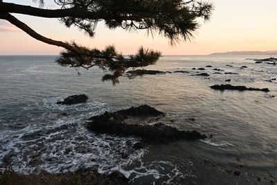 Scenic view of sea against sky during sunset