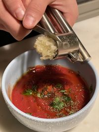 Midsection of person holding soup in bowl