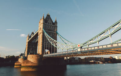 Low angle view of tower bridge over thames river against sky