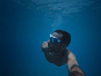 Portrait of man swimming in sea