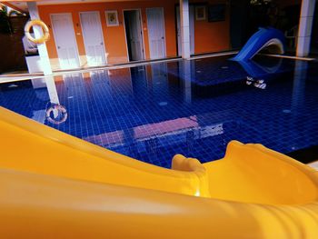 High angle view of playground by swimming pool