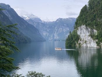 Scenic view of lake and mountains against sky