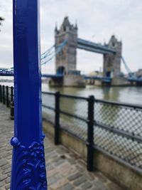 Close-up of suspension bridge over river