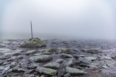 Scenic view of rocks against sky during winter