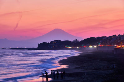 Scenic view of sea against sky at sunset