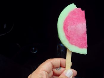 Cropped image of hand holding ice cream