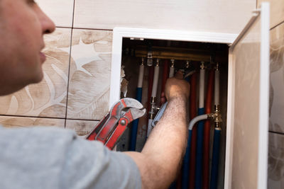 Close-up of man working at home