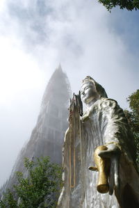 Low angle view of statue against sky