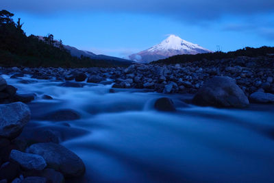Scenic view of landscape and mountains against sky