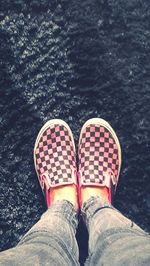 Low section of woman standing on carpet