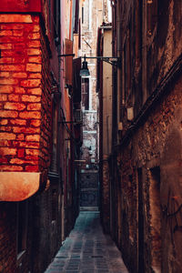 Narrow alley amidst buildings in city