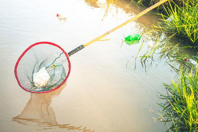 High angle view of fishing net on lake