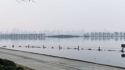 Scenic view of city against sky during winter