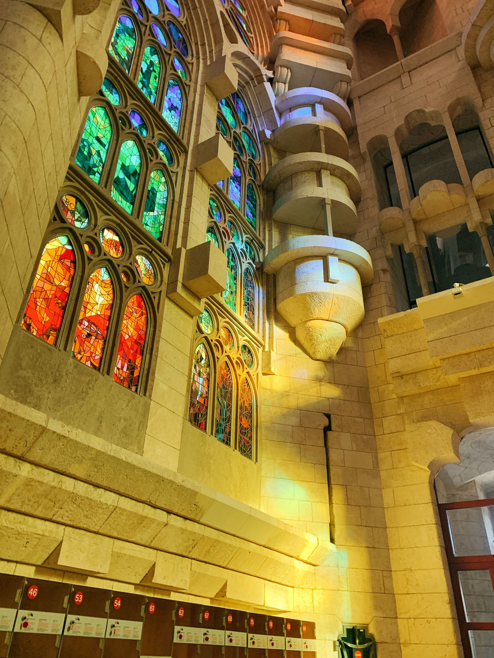 LOW ANGLE VIEW OF ILLUMINATED BUILDING AT TEMPLE