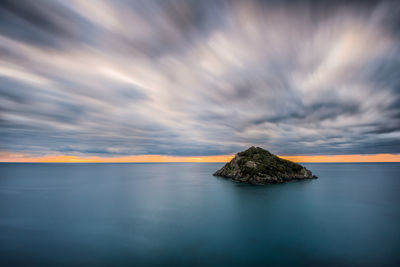 Scenic view of sea against sky at sunset