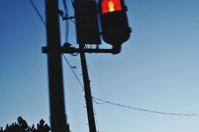 Low angle view of pole against blue sky