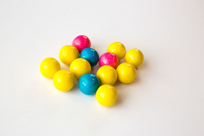 Close-up of colorful balloons over white background