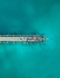 Droneshot of a jetty with turquoise water which is located at koh rong sanloem, cambodia.