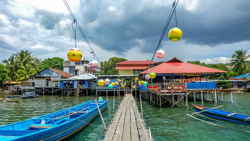 Panoramic view of multi colored houses against sky