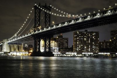 Illuminated suspension bridge at night
