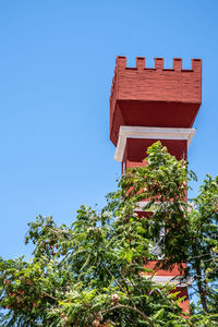 Low angle view of building against clear blue sky