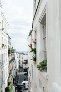 Buildings in city against sky