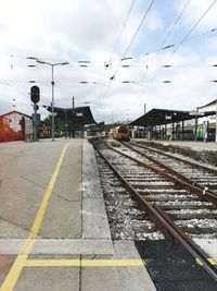 Railroad station platform against sky